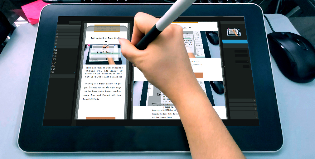 Drawing tablet designing a strategic website for desktop and mobile versions